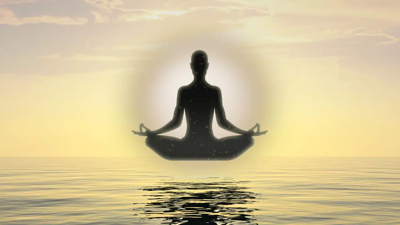Illustration of a person meditating or practicing mindfulness, with soft, glowing light surrounding them, symbolizing the flow of prana or life energy in pranic healing.
